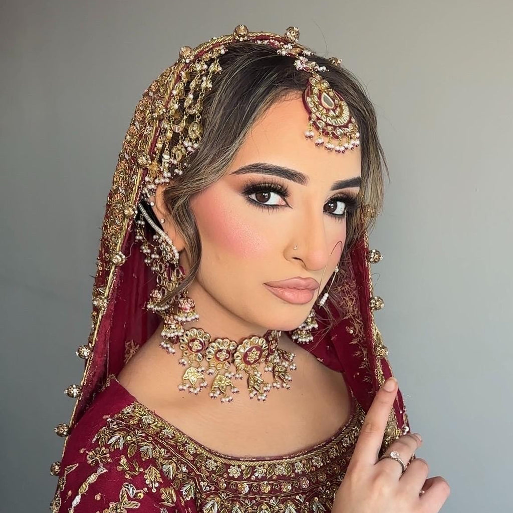 24k Gold Plated Kundan Bridal Jewellery Set, Includes choker, earrings, tikka, jhumar and nose ring.